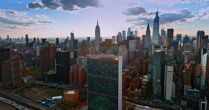 Densely built downtown of modern New York at sunset. Beautiful urban architecture from drone footage.