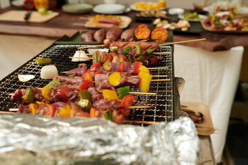 Delicious kebabs on grill ready to be cooked