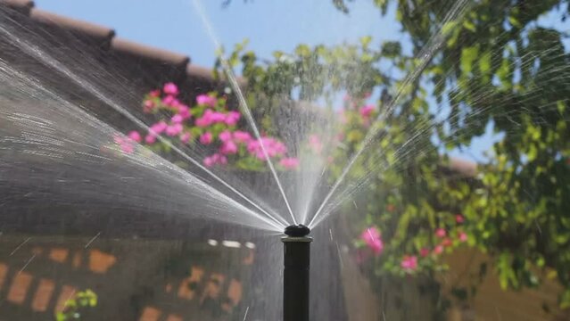 MP_Rotator_Sprinkler_In_Back_Yard_Goes_Down_HD