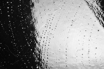 Foam traces. Wet soap foam with bubbles. Foam on a dark