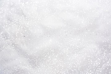 Fototapeta premium Elegant silver white glitter sparkle confetti background for Christmas snow, New Year, Birthday, anniversary celebration wallpaper with copyspace