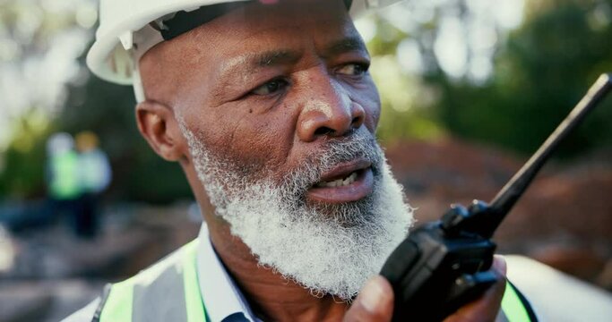 Mature, black man and radio communication on construction with foreman for instructions, problem solving and technical support. Person, wireless transmission and speaking outdoor for architecture.