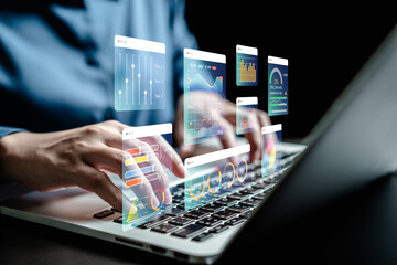 Data analyst use laptop to analyze charts business data on dashboard virtual screen, technology...