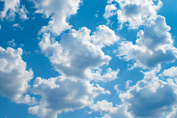Fototapeta premium A photograph of a clear blue sky filled with fluffy white clouds