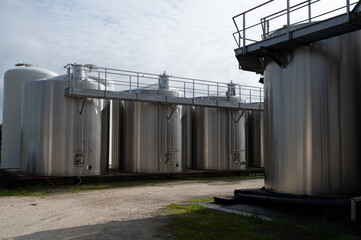Works at distillery in Cognac white wine region, Charente, steel tanks for fermentation of ugni blanc grape uses for Cognac strong spirits distillation, Grand Champagne, France