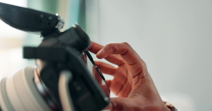 Photoshoot, camera and hands of person on set for shot, photography and media backstage. Photographer, closeup and worker with equipment for shooting fashion, style and clothing for magazine catalog