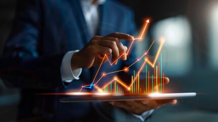 Businessman with a blurred face interacts with futuristic digital growth charts projected from a tablet
