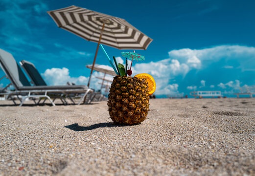 Pineapple cocktails at summer beach. Summer vacation.