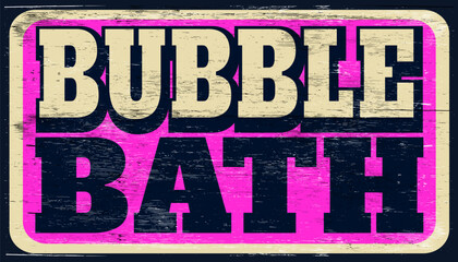 Aged and worn bubble bath sign on wood