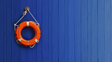 An orange lifebuoy hangs from a white cord on a royal blue wooden background The concept of safety of people on the water river sea ocean Decorative nautical style Extra wide banner : Generative AI