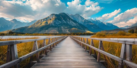 Fototapeta premium pathway stretching towards majestic mountain range - nature, exploration, outdoor activities