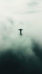 Aerial view of the Christ the Redeemer statue in the fog.