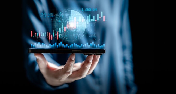 Businesswomen use smartphone apps for scan radar to find stock in stock markets, uptrends, growth economics, business strategy development, and find opportunities for investment. - Powered by Adobe