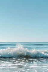 Fototapeta premium A solitary wave in a calm sea under a clear sky.