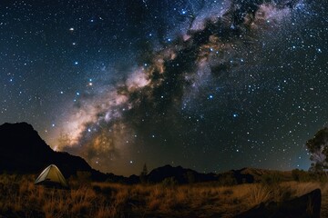 Obraz premium a tent pitched in starring night