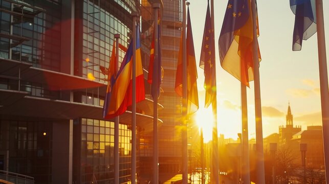 European Union and other national flags displayed against a sunset, symbolizing international relations and diplomacy