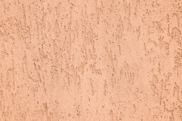 Peach fuzz textured surface, closeup. Trendy shade of 2024 year