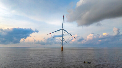 Landscape with Turbine Green Energy Electricity, Windmill for electric power production, Wind turbines generating electricity on ocean at Ba Dong, Tra Vinh, Vietnam. Clean energy concept.