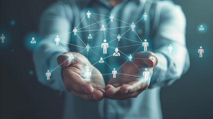 Businessman holding virtual Human Resources network connection icons. Employee Engagement, Talent Management, Workforce Connectivity. Internet business and social network