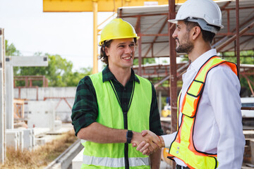 Engineer team discuss and examine a building construction.