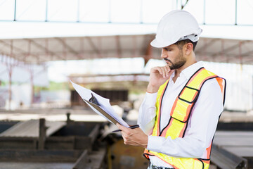 Fototapeta premium Hispanic male engineer working at construction site.
