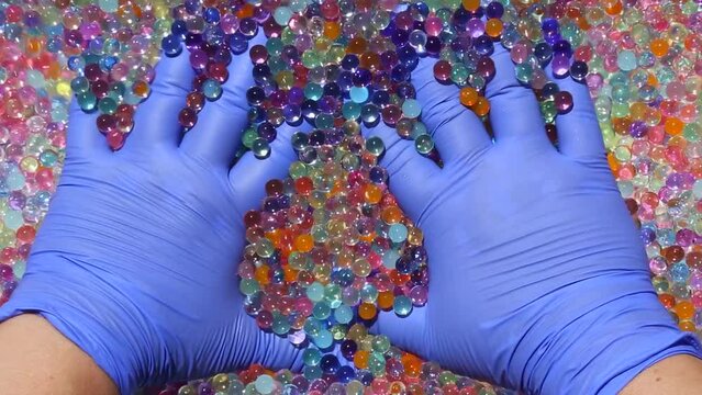 The fingers slowly sink into the shiny, multicolored orbis. His hands are moving colorful shiny balls. Asmr. Part 5.14