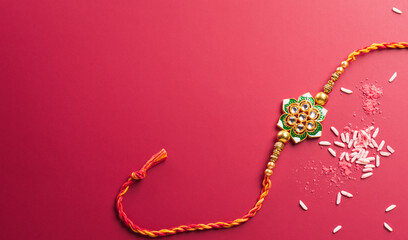 Raksha Bandhan, Indian festival with beautiful Rakhi and Rice Grains. A traditional Indian wrist band which is a symbol of love between Sisters and Brothers