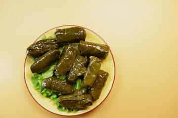 Traditional dolma grape leaves on a plate 
