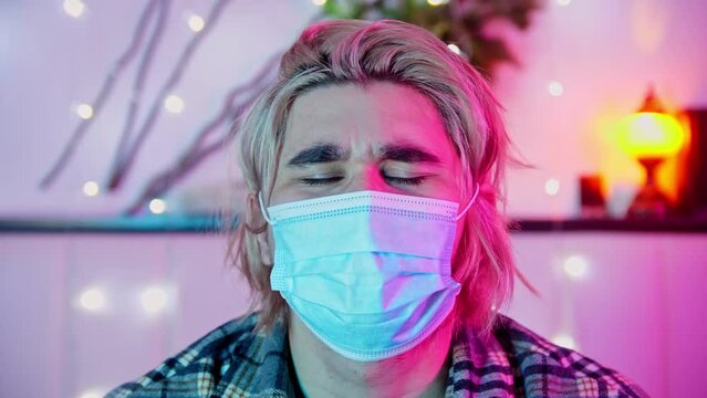 Guy unsuccessfully puts a protective mask right over his eyes, but then corrects it