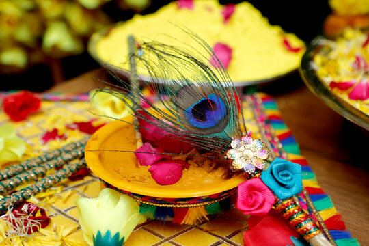 Haldi for haldi ceremony and bridal shower,  Traditional Haldi turmeric kept on a flower plate for the hindu marriage ceremony. This paste of sandal, oil and turmeric is applied by all relatives befor