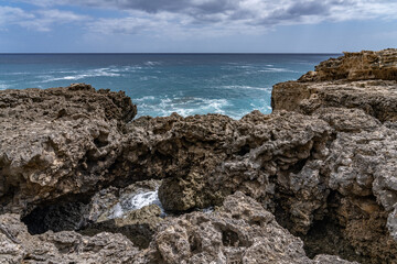 Coral reef and beachrocks，Beachrock is a friable to well-cemented sedimentary rock. Kaena point / Yokohama bay, Leeward Coast of Oahu, Hawaii.