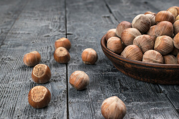 Rustic Bowl of Hazelnuts on Weathered Wooden Table for Culinary and Kitchen Themes