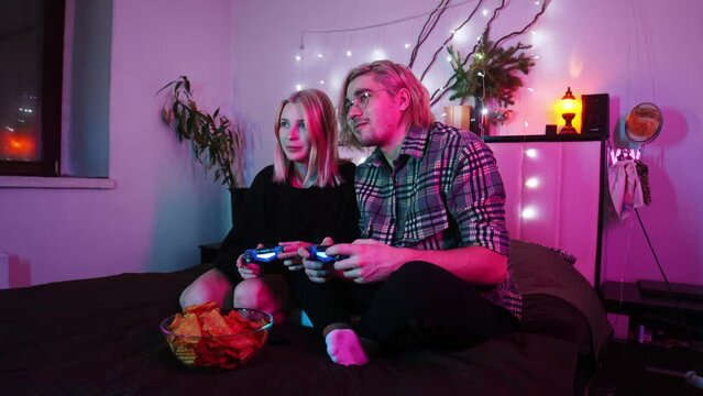 Guy wins a video game on his girlfriend's console, which makes her feel resentful towards him.