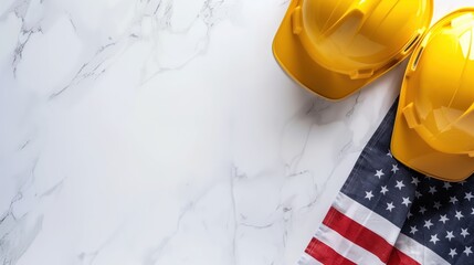 Construction tools and American flag on a white marble background for a patriotic workspace