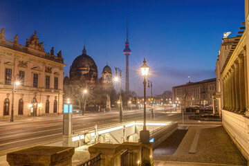 The famous Unter den Linden boulevard in Berlin with the TV Tower at dawn