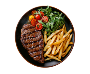 Grilled sliced beef steak with French fries and tomatoes on white plate