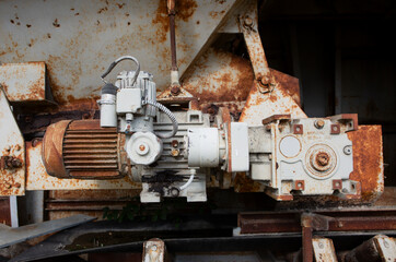 Rusty old electric motor, detailed close-up of weathered industrial machinery