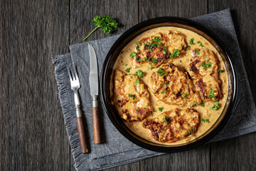 creamy smothered pork chops cooked in onion gravy