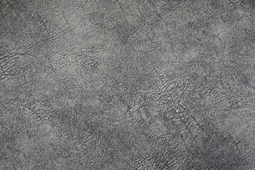 The surface is wrinkled and dark gray, suitable for flooring.