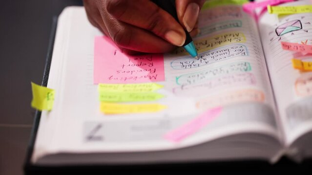 Organizing Events and Finances: African American Woman Managing a Busy Schedule