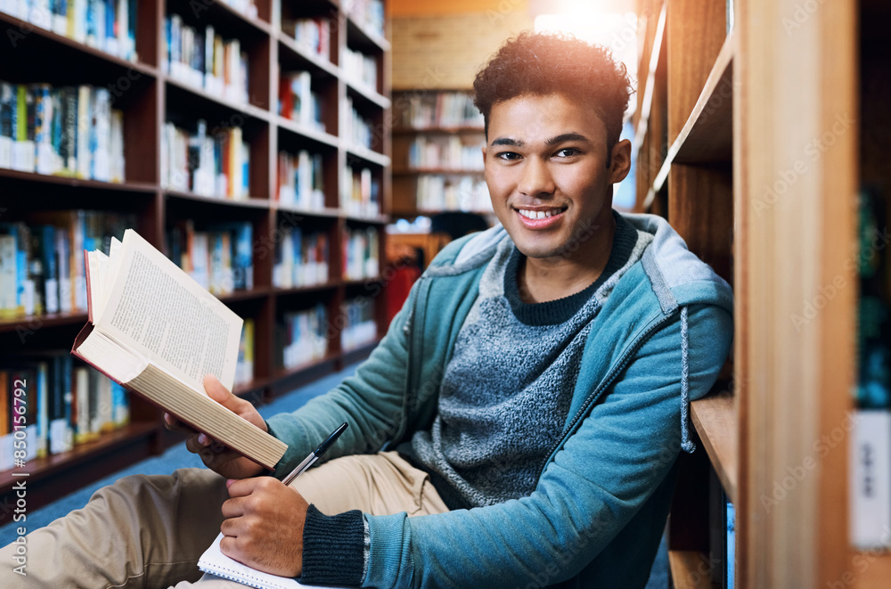 Poster student, man and portrait with writing in library for studying, scholarship and reading a book for e