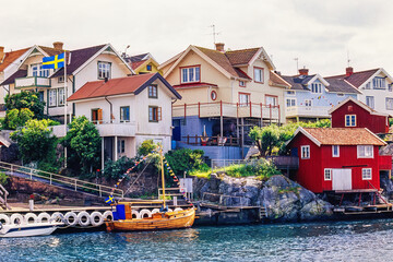 Fishing boat at a jetty by a swedish fishing village in the summer