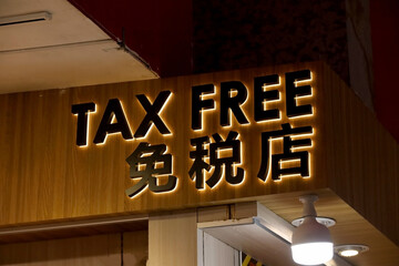 Tax free writing on the wall of a shop at the airport. concept of tax on purchase of goods and tax refund.