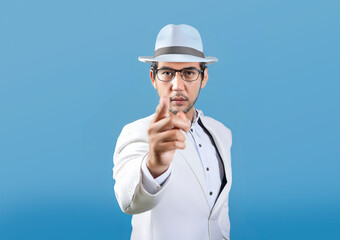 Asian model pointing finger at camera showing seriousness on isolated background. Can be used for advertisements to attract attention to you