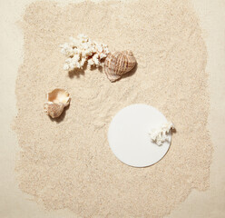 A summer prop and circle marble podium against a sea sand background. top view. An empty space for display cosmetic products, food and props.