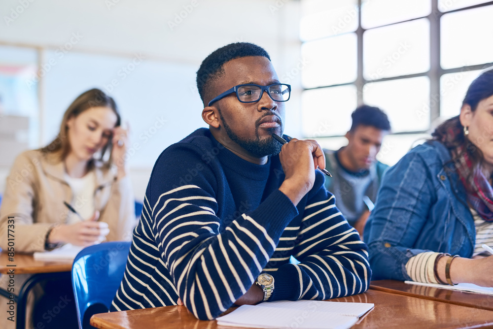 Poster Student, thinking and black man in college classroom for education, test or exam. Idea, university and studying in lecture for problem solving, doubt or brainstorming for learning knowledge at school