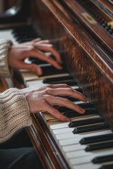 Obraz premium A close-up shot of a person's hands playing a piano