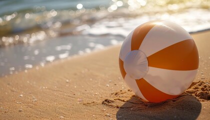 Obraz premium Beach inflatable ball on sand near sea
