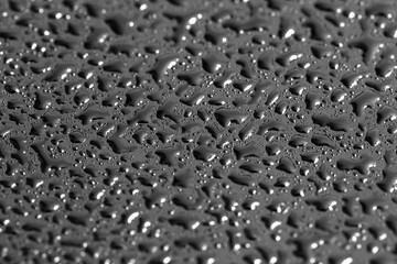 Water drops on a black background. Texture