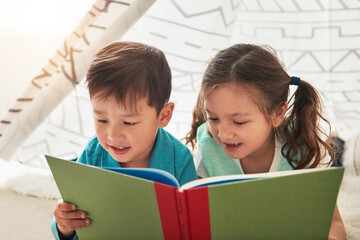 Siblings, reading and tent in home with book for story time, education and literature adventure for...